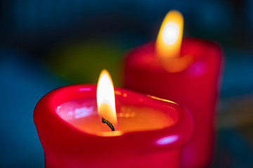 Image showing Two red burning candels 