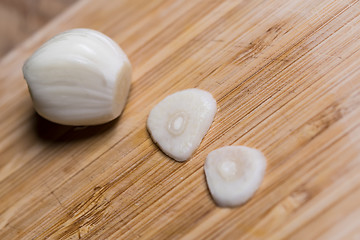 Image showing Closeup of a sliced garlic glove