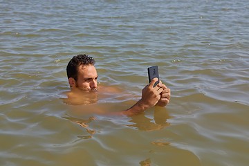 Image showing Smartphone at the beach