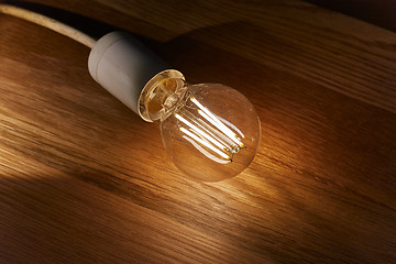 Image showing Light bulb on a table