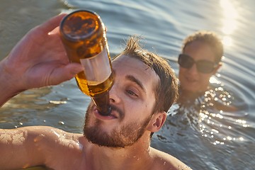 Image showing Summer beach fun drinking beer