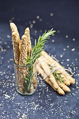 Image showing Italian grissini or salted bread sticks with sesame and rosemary