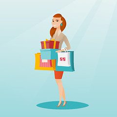 Image showing Woman holding shopping bags and gift boxes.