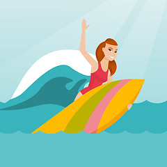 Image showing Young caucasian surfer in action on a surfboard.