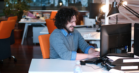 Image showing businessman working using a computer in startup office