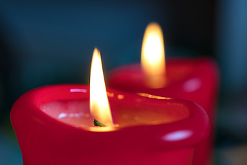 Image showing Two red burning candels 