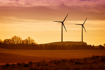 Image showing Power Windmills with fields and trees