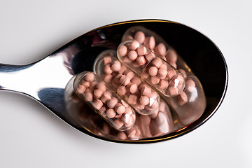 Image showing Tablets on a spoon