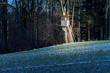 Image showing Deerstand with field and forest in Bavaria, Germany in winter