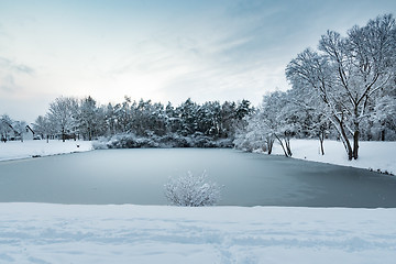 Image showing Image of a pond with trees and heavy snow in village Gernlinden