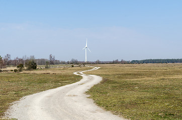 Image showing Winding country road leading to a windmill