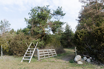 Image showing Wooden stile and an open wooden gate in the countryside