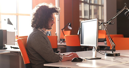 Image showing businessman working using a computer in startup office