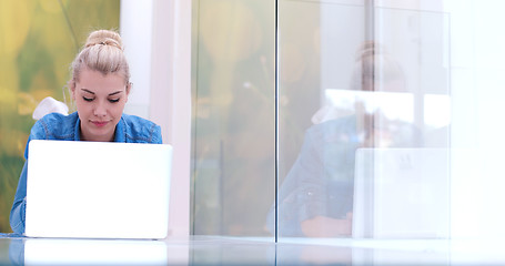 Image showing young women using laptop computer on the floor