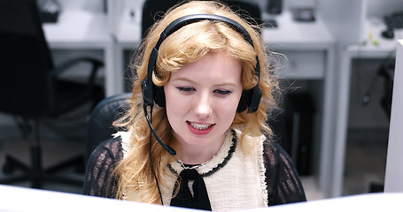 Image showing female call centre operator doing her job