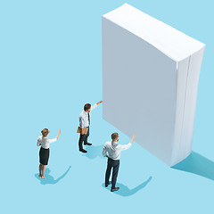 Image showing Flat isometric view of businessmen and woman showing at blank sheets of paper with empty copy space