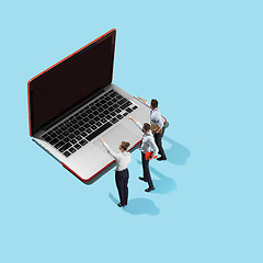 Image showing Flat isometric view of businessmen and woman showing at laptop with empty screen.