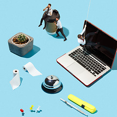 Image showing Shot from above of a stylish business men working on a laptop.