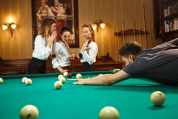 Image showing Close-up shot of a man playing billiard