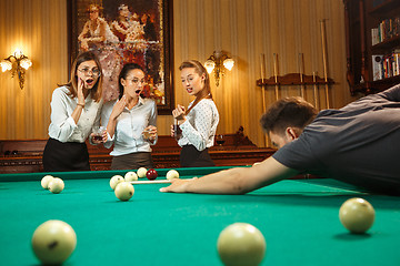 Image showing Close-up shot of a man playing billiard