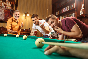 Image showing Close-up shot of a man playing billiard