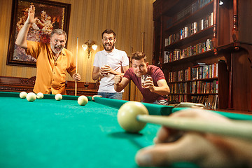 Image showing Close-up shot of a man playing billiard