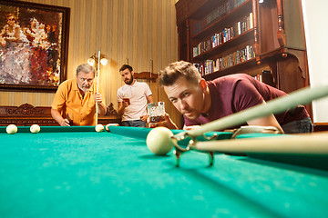 Image showing Close-up shot of a man playing billiard