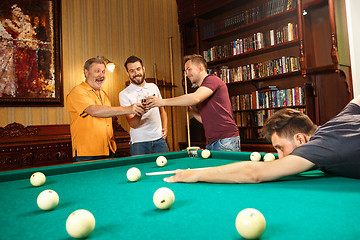 Image showing Close-up shot of a man playing billiard