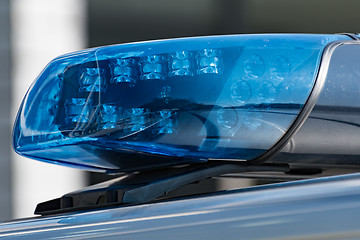 Image showing Detail shot of a blue light on a police car