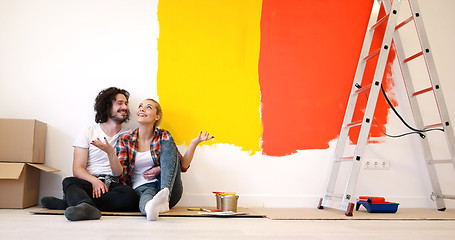 Image showing Happy young couple relaxing after painting