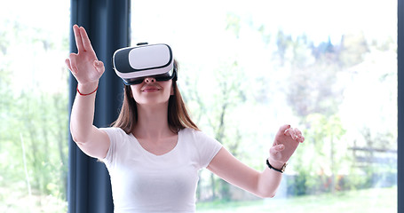 Image showing woman using VR-headset glasses of virtual reality