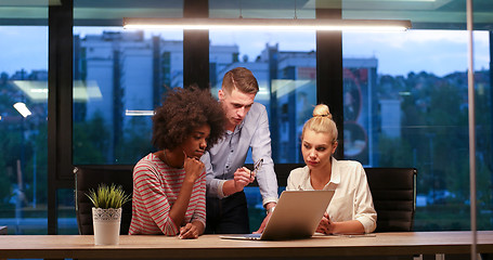 Image showing Multiethnic startup business team in night office