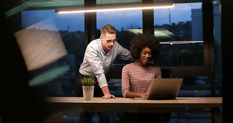 Image showing Multiethnic startup business team in night office