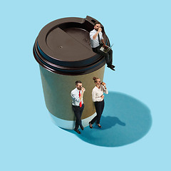 Image showing Flat isometric view of businessmen and woman with big cup of cof