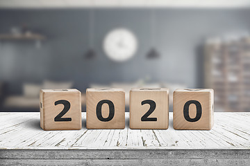 Image showing Year 2020 sign on a wooden desk in a cozy kitchen