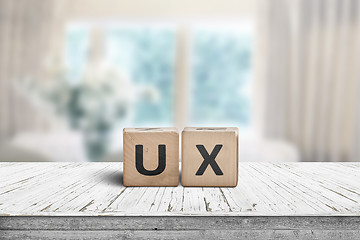 Image showing UX development sign on a table in a bright room