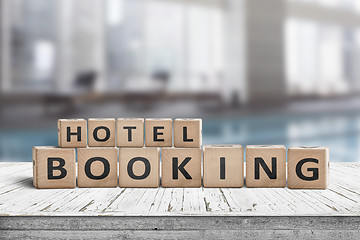 Image showing Hotel booking sign on a wooden step