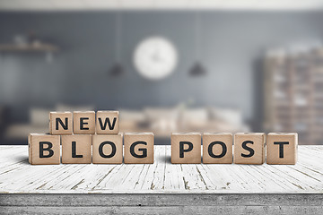 Image showing New blog post sign on a wooden desk