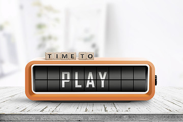 Image showing Time to play message on a retro alarm clock