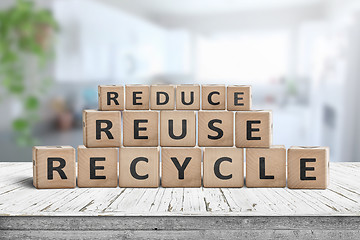 Image showing Reduce, reuse and recycle sing on a wooden desk