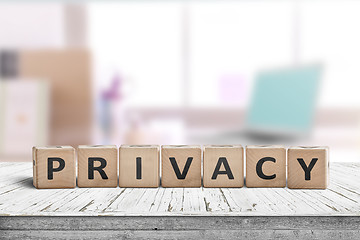 Image showing Privacy sign on a wooden table in a bright room