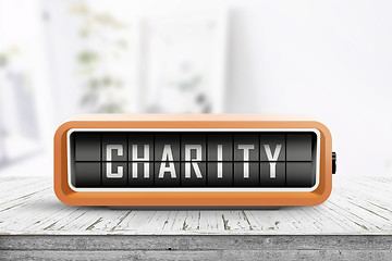 Image showing Charity written on an old device