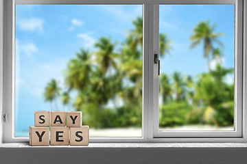 Image showing Say yes sign in a window on a tropical beach