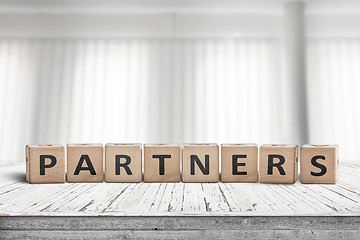 Image showing Partners sign on a desk in a bright office