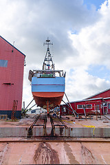 Image showing Boat on land at the docks