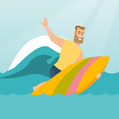 Image showing Young caucasian surfer in action on a surfboard.