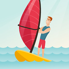 Image showing Young caucasian man windsurfing in the sea.