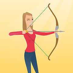 Image showing Young caucasian archer training with a bow.