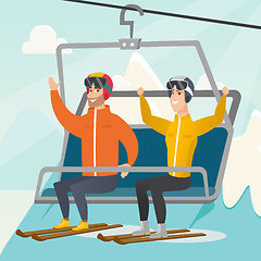 Image showing Two caucasian skiers using cableway at ski resort.