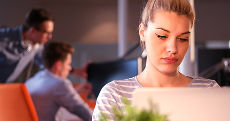 Image showing businesswoman using a laptop in startup office